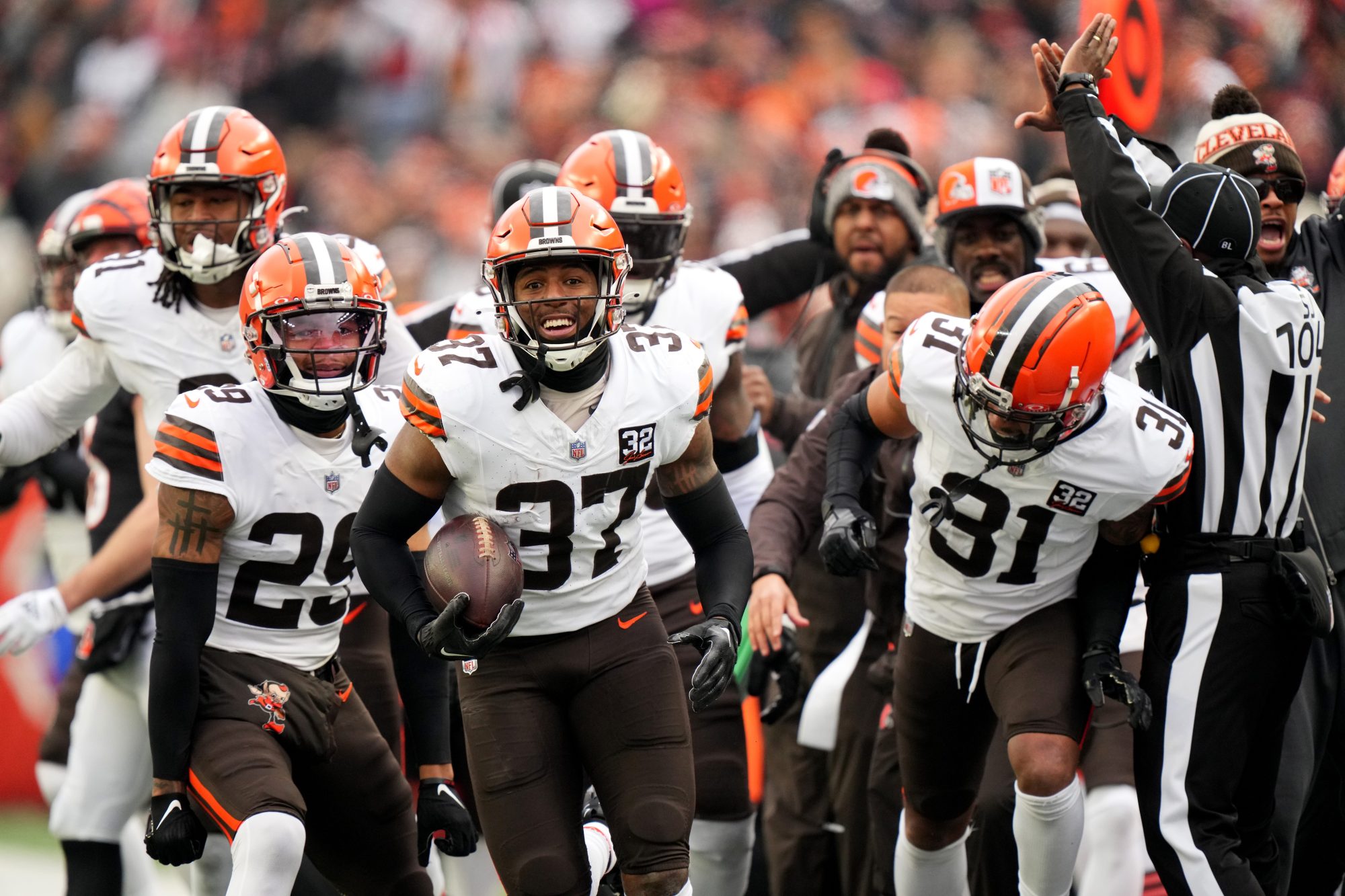 Cleveland Browns safety D'Anthony Bell (37), center, celebrates an interception in the first quarter during a Week 18 NFL football game between the Cleveland Browns at Cincinnati Bengals, Sunday, Jan. 7, 2024, at Paycor Stadium in Cincinnati.