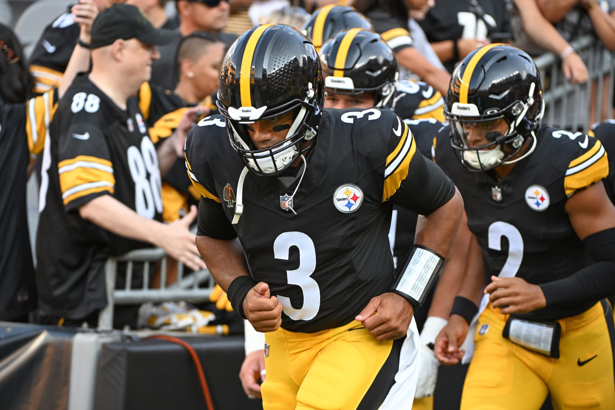 Aug 9, 2024; Pittsburgh, Pennsylvania, USA; Pittsburgh Steelers quarterback Russell Wilson (3) and Justin Fields (2) take the field for pre-game against the Houston Texans at Acrisure Stadium.