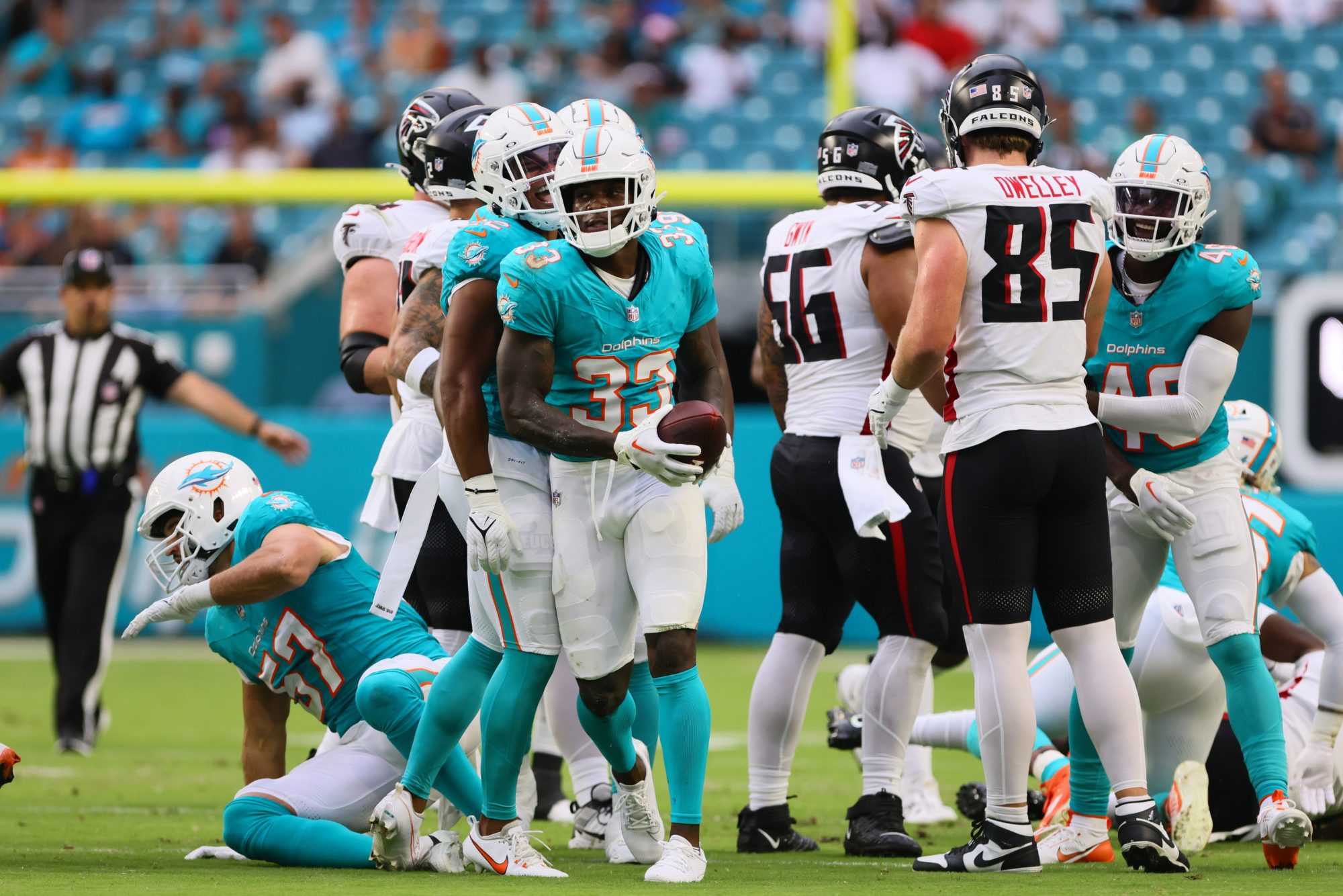 Aug 9, 2024; Miami Gardens, Florida, USA; Miami Dolphins cornerback Siran Neal (33) celebrates after recovering a fumble against the Atlanta Falcons during the first quarter at Hard Rock Stadium.