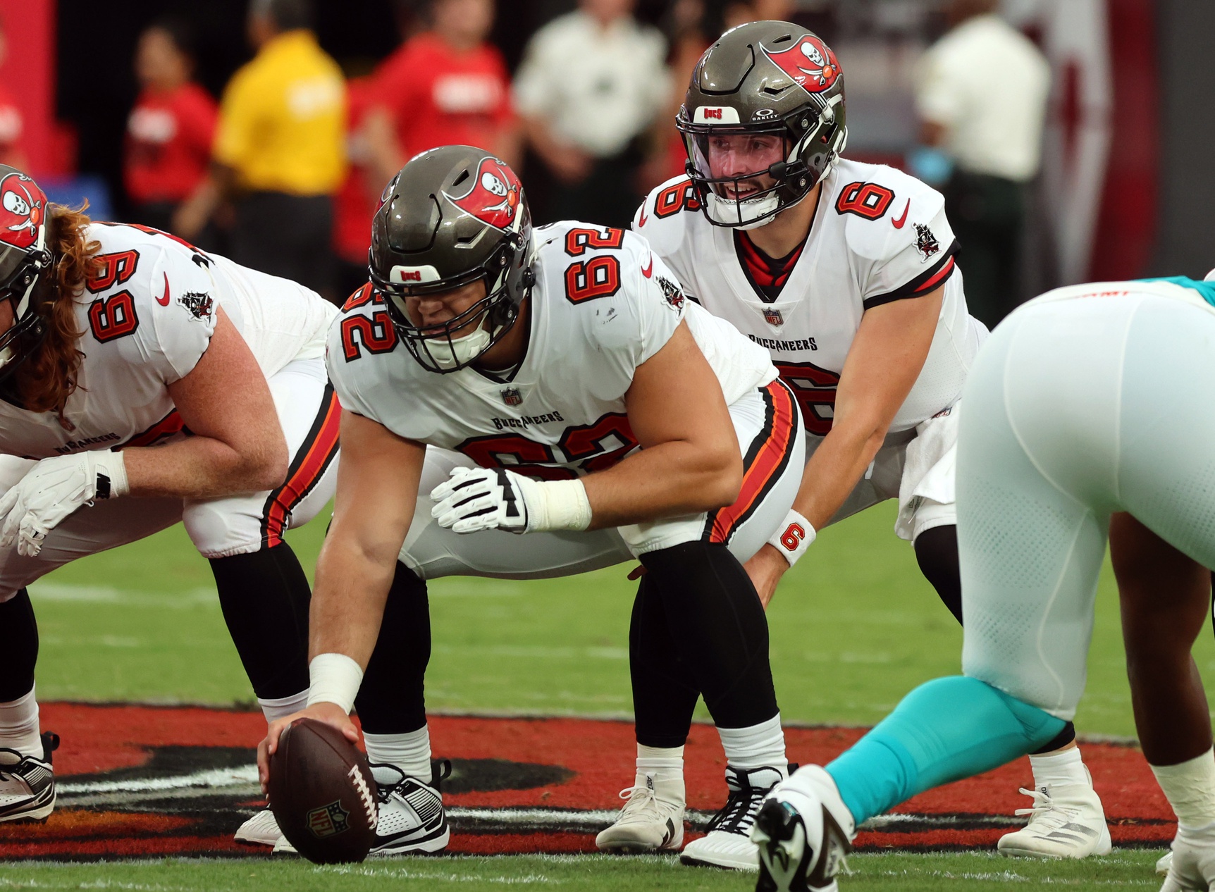 Aug 23, 2024; Tampa, Florida, USA; Tampa Bay Buccaneers center Graham Barton (62) hikes the ball to Tampa Bay Buccaneer quarterback Baker Mayfield (6) against the Miami Dolphins during the first quarter at Raymond James Stadium.