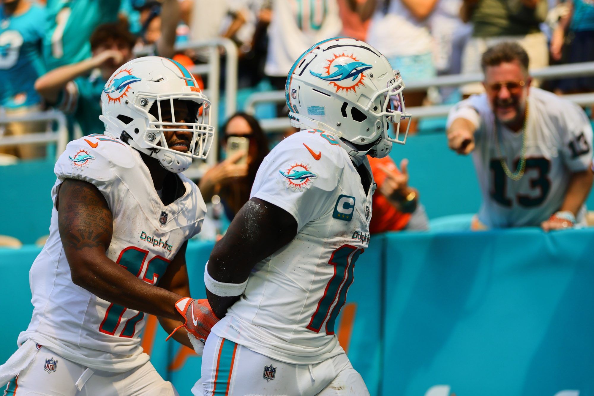 Sep 8, 2024; Miami Gardens, Florida, USA; Miami Dolphins wide receiver Tyreek Hill (10) celebrates with wide receiver Jaylen Waddle (17) after scoring a touchdown against the Jacksonville Jaguars during the third quarter at Hard Rock Stadium.