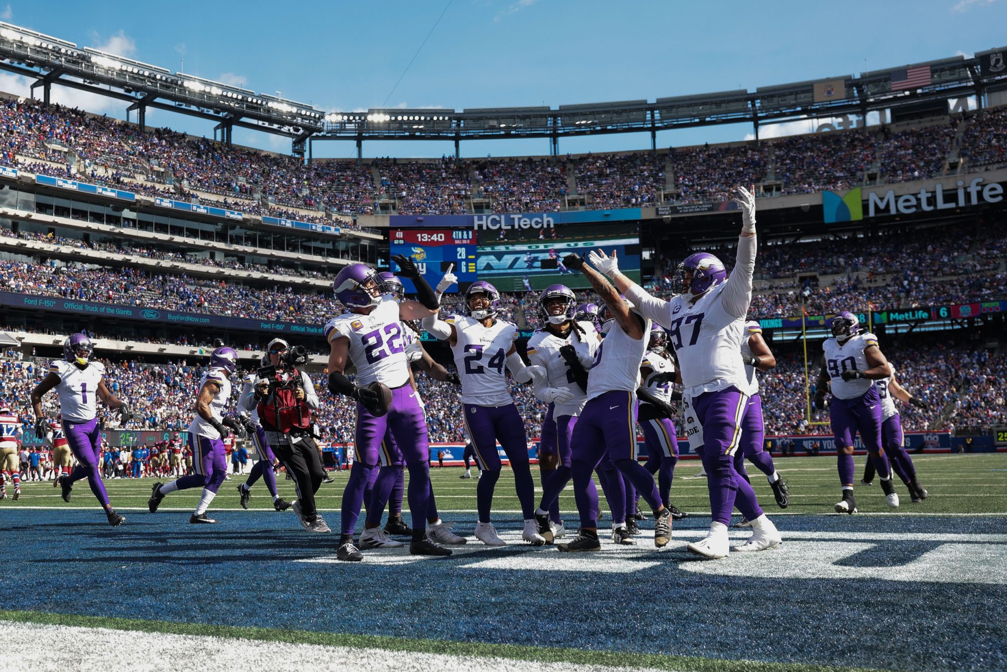 Sep 8, 2024; East Rutherford, New Jersey, USA; Minnesota Vikings safety Harrison Smith (22) celebrates his interception with teammates during the second half against the New York Giants at MetLife Stadium.