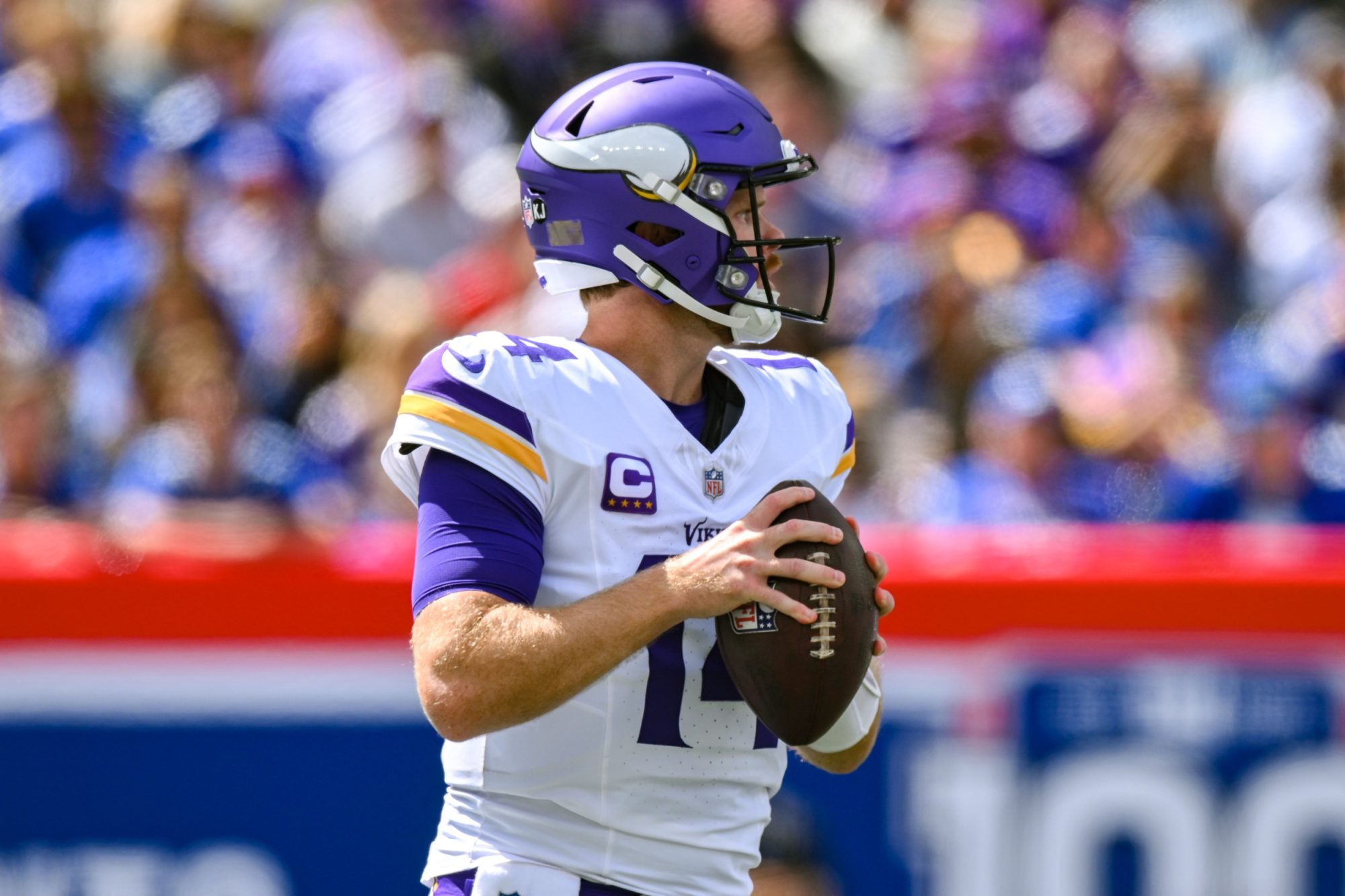 Sep 8, 2024; East Rutherford, New Jersey, USA; Minnesota Vikings quarterback Sam Darnold (14) drops back to pass against the New York Giants during the first half at MetLife Stadium.