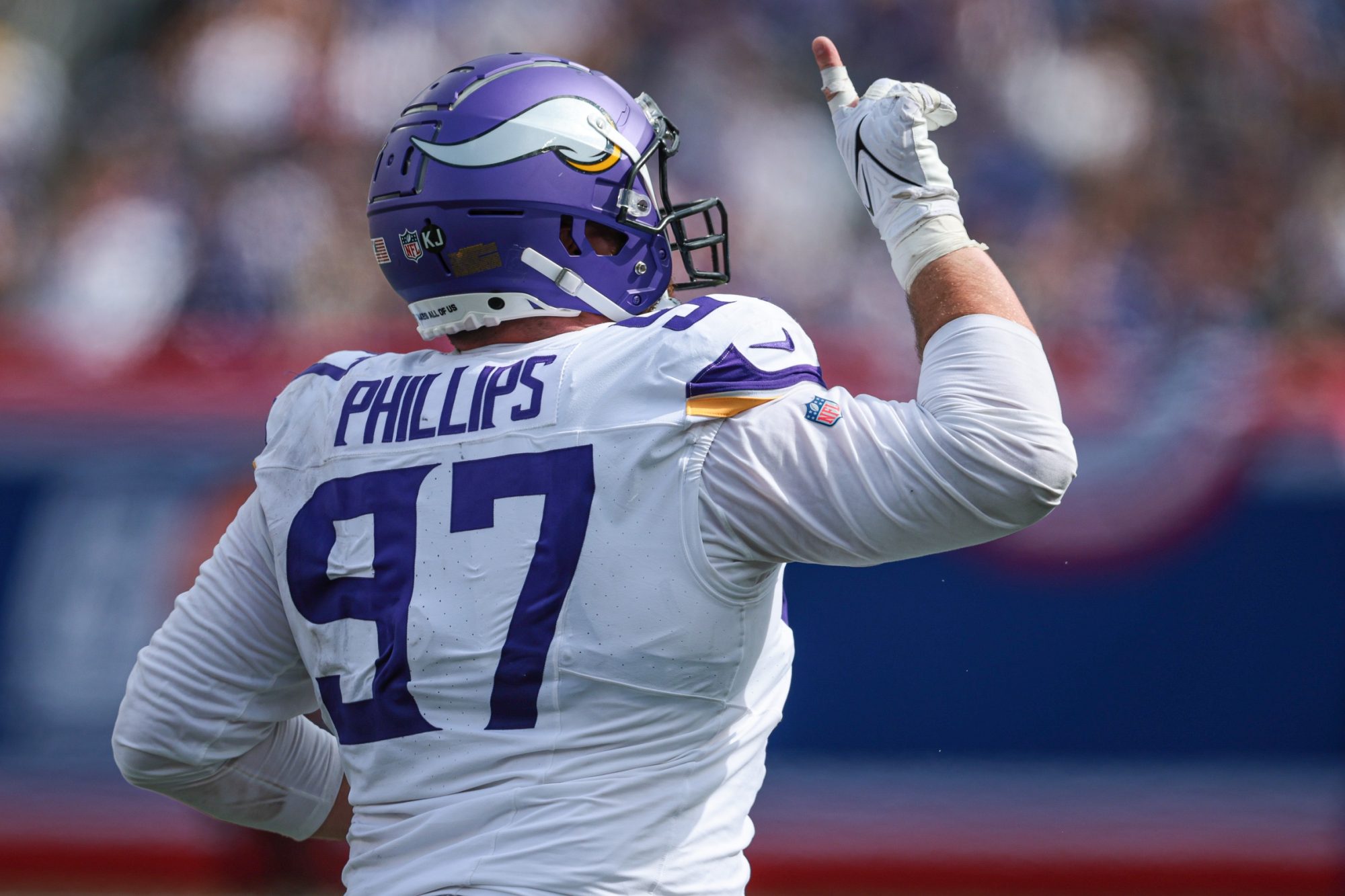 Sep 8, 2024; East Rutherford, New Jersey, USA; Minnesota Vikings defensive tackle Harrison Phillips (97) celebrates a defense stop during the second half against the New York Giants at MetLife Stadium.