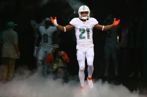 Sep 8, 2024; Miami Gardens, Florida, USA; Miami Dolphins safety Jordan Poyer (21) runs onto the field before the game against the Jacksonville Jaguars at Hard Rock Stadium.