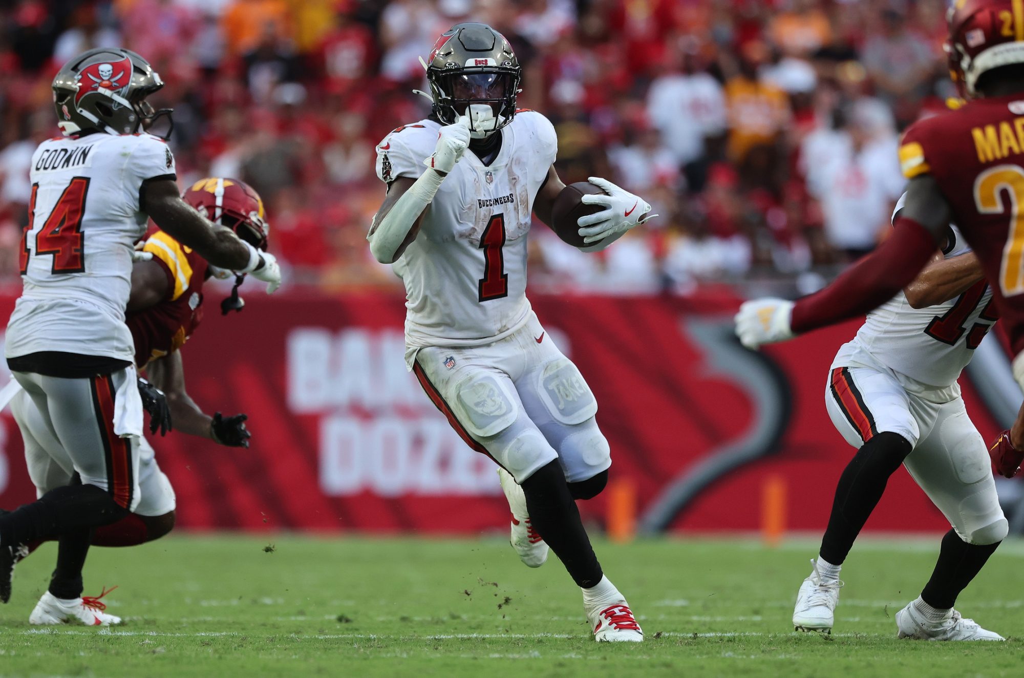 Sep 8, 2024; Tampa, Florida, USA; Tampa Bay Buccaneers running back Rachaad White (1) runs with the ball against the Washington Commanders during the second half at Raymond James Stadium.