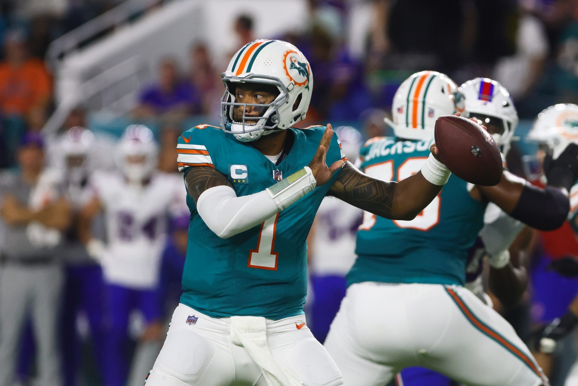 Sep 12, 2024; Miami Gardens, Florida, USA; Miami Dolphins quarterback Tua Tagovailoa (1) throws the football against the Buffalo Bills during the first quarter at Hard Rock Stadium.