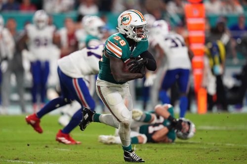 Sep 12, 2024; Miami Gardens, Florida, USA; Miami Dolphins running back De'Von Achane (28) rushes with the ball against the Buffalo Bills during the second half at Hard Rock Stadium.