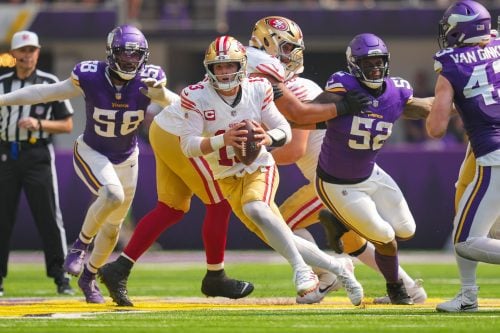 Sep 15, 2024; Minneapolis, Minnesota, USA; San Francisco 49ers quarterback Brock Purdy (13) scrambles against the Minnesota Vikings in the second quarter at U.S. Bank Stadium.