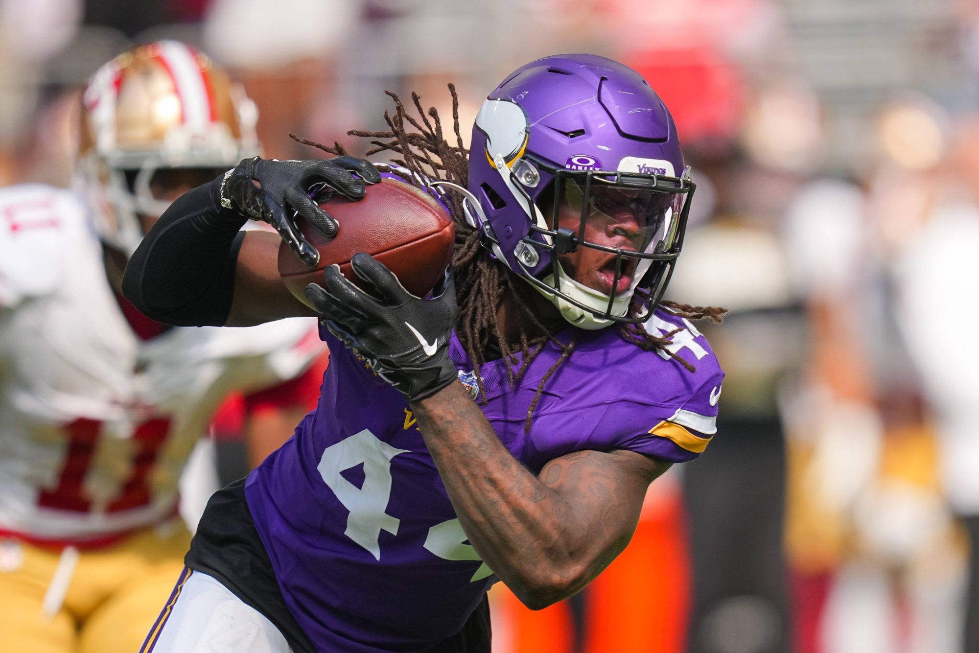 Sep 15, 2024; Minneapolis, Minnesota, USA; Minnesota Vikings safety Josh Metellus (44) intercepts the ball against the San Francisco 49ers in the third quarter at U.S. Bank Stadium.