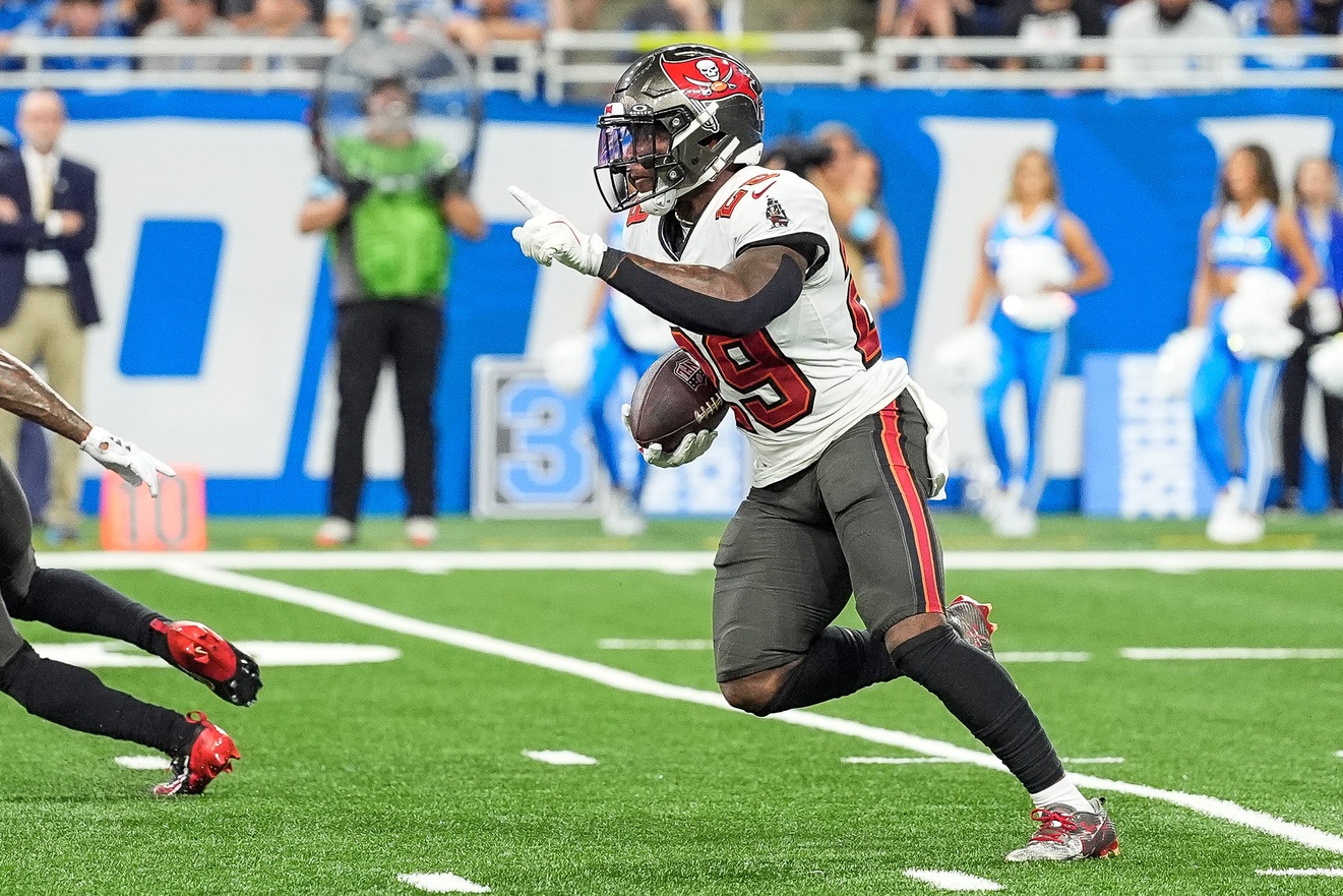 Tampa Bay Buccaneers safety Christian Izien (29) runs after intercepts a pass from Detroit Lions quarterback Jared Goff (16) during the second half at Ford Field in Detroit on Sunday, September 15, 2024.