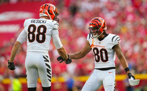 Sep 15, 2024; Kansas City, Missouri, USA; Cincinnati Bengals wide receiver Andrei Iosivas (80) celebrates with tight end Mike Gesicki (88) after an interception during the first half against the Kansas City Chiefs at GEHA Field at Arrowhead Stadium.