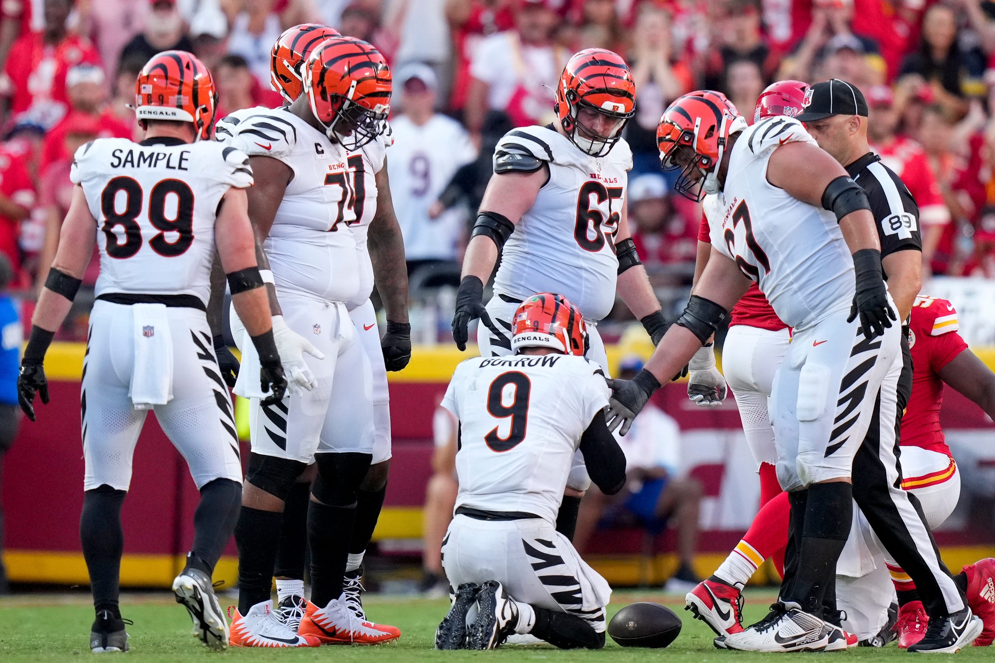 Cincinnati Bengals quarterback Joe Burrow (9) is slow to his feet after being sacked in the fourth quarter of the NFL Week 2 game between the Kansas City Chiefs and the Cincinnati Bengals at Arrowhead Stadium in Kansas City on Sunday, Sept. 15, 2024. The Chiefs took a 26-25 win with a go-ahead field goal as time expired.