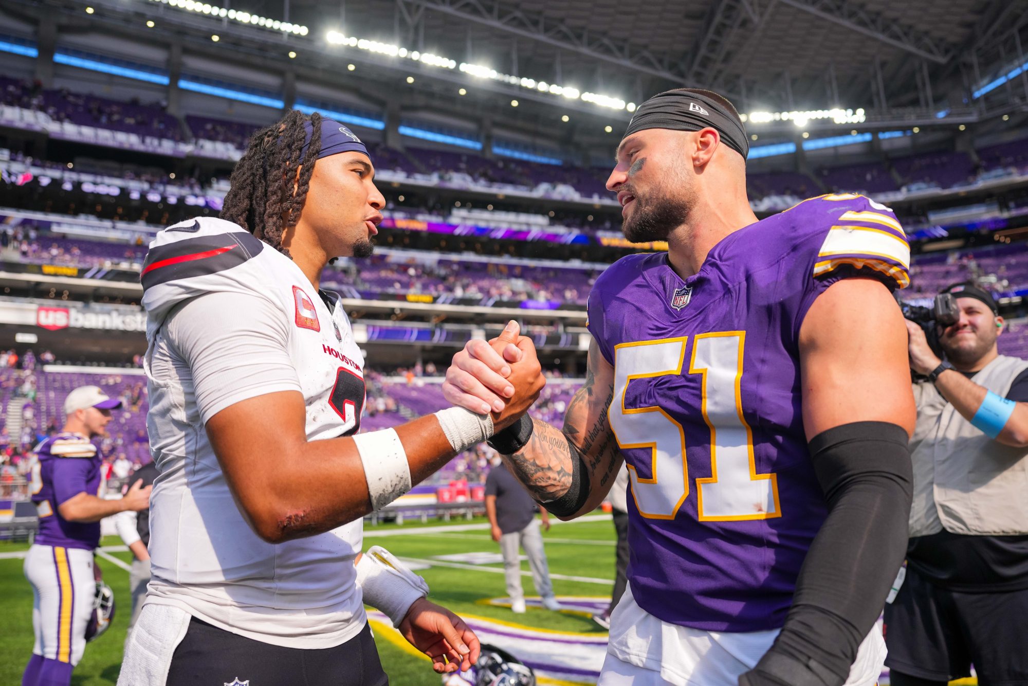 Sep 22, 2024; Minneapolis, Minnesota, USA; Houston Texans quarterback C.J. Stroud (7) and Minnesota Vikings linebacker Blake Cashman (51) after the game at U.S. Bank Stadium.