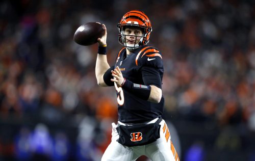 Jan 15, 2023; Cincinnati, Ohio, USA; Cincinnati Bengals quarterback Joe Burrow (9) throws a pass to convert on a two-point conversion during the second half against the Baltimore Ravens in a wild card game at Paycor Stadium.