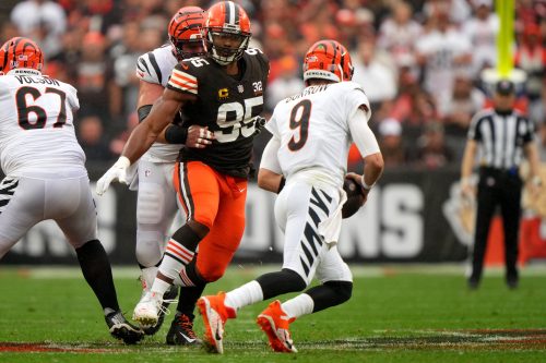 Cleveland Browns defensive end Myles Garrett (95) pressured Cincinnati Bengals quarterback Joe Burrow (9) as Cincinnati Bengals center Ted Karras (64) blocks in the first quarter of an NFL football game between the Cincinnati Bengals and Cleveland Browns, Sunday, Sept. 10, 2023, at Cleveland Browns Stadium in Cleveland.