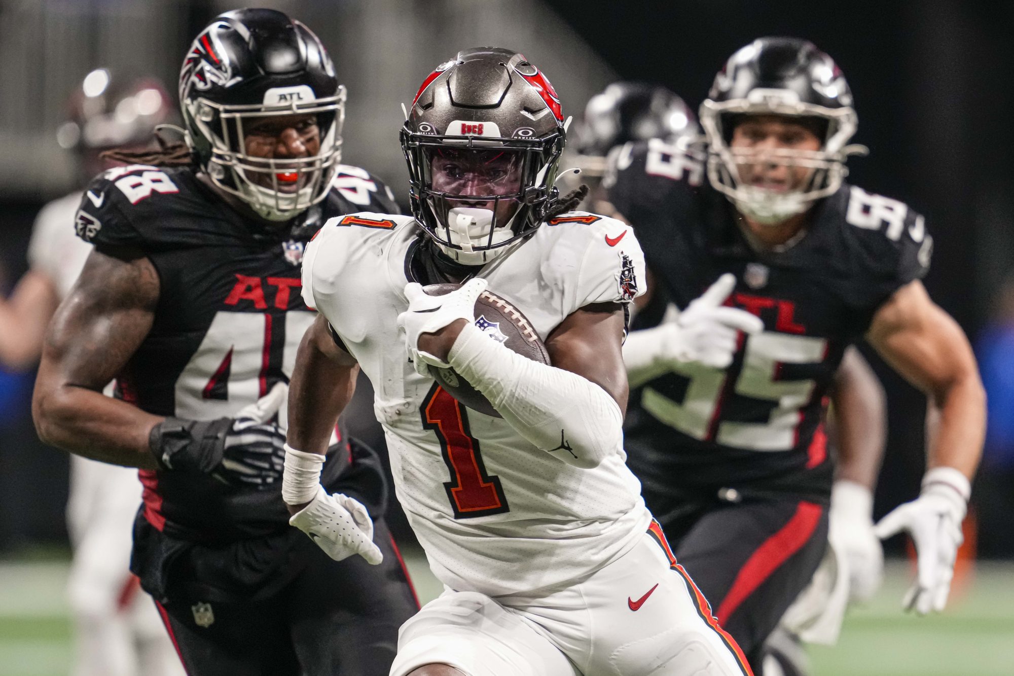 Dec 10, 2023; Atlanta, Georgia, USA; Tampa Bay Buccaneers running back Rachaad White (1) runs for a touchdown against the Atlanta Falcons during the second half at Mercedes-Benz Stadium.