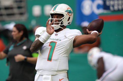 Miami Dolphins quarterback Tua Tagovailoa warms up before the game against the New York Jets in Week 15.