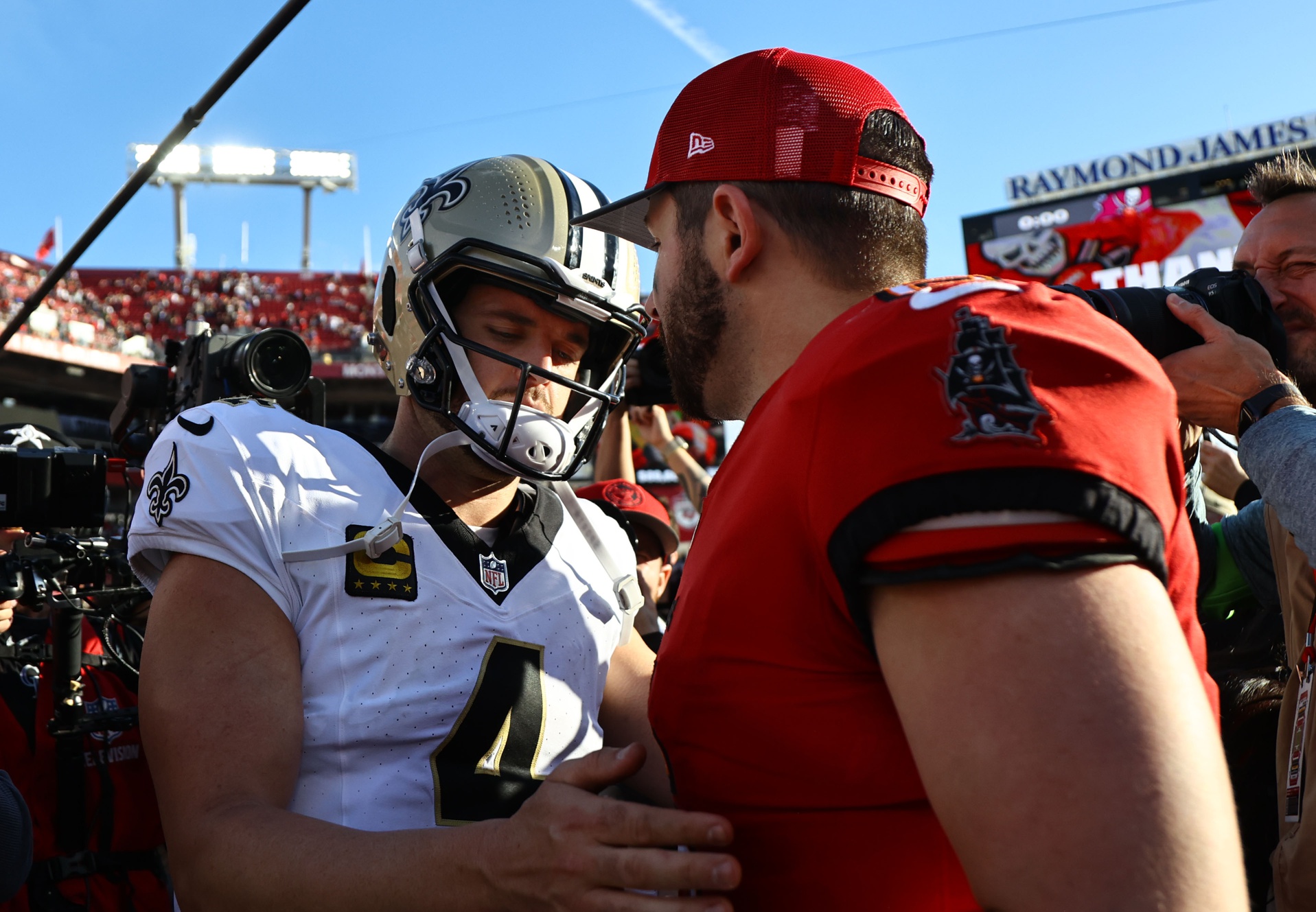 Dec 31, 2023; Tampa, Florida, USA; New Orleans Saints quarterback Derek Carr (4) and Tampa Bay Buccaneers quarterback Baker Mayfield (6) greet after the game at Raymond James Stadium.