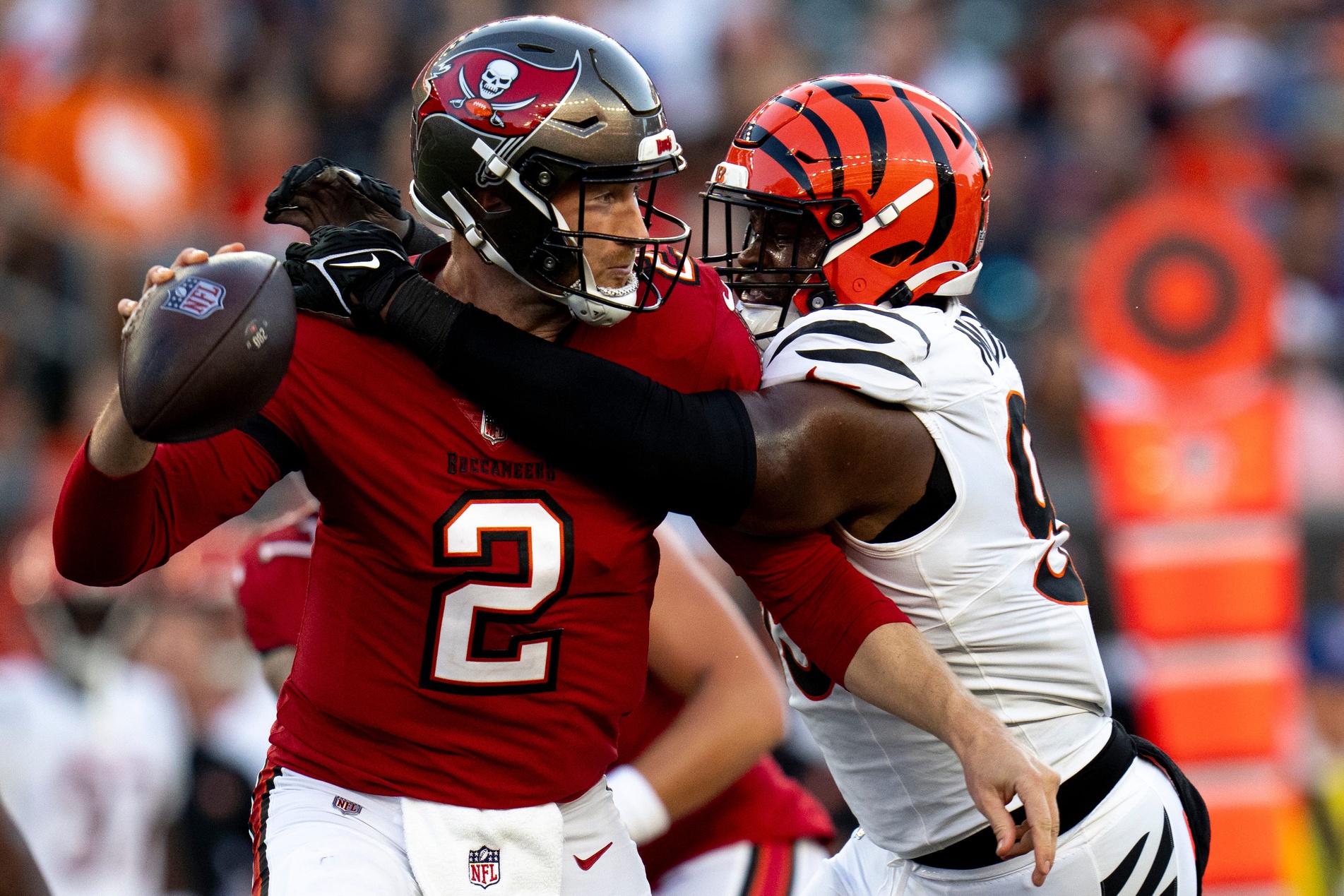 Cincinnati Bengals defensive end Myles Murphy (99) hits Tampa Bay Buccaneers quarterback Kyle Trask (2) causing an incomplete pass in the second quarter of the NFL preseason game at Paycor Stadium in Cincinnati on Saturday, August 10, 2024.