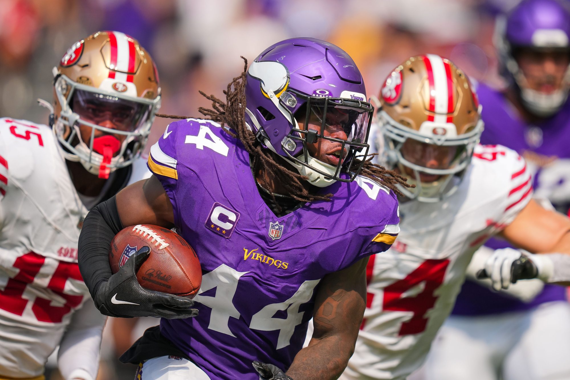 Sep 15, 2024; Minneapolis, Minnesota, USA; Minnesota Vikings safety Josh Metellus (44) intercepts the ball against the San Francisco 49ers in the third quarter at U.S. Bank Stadium.