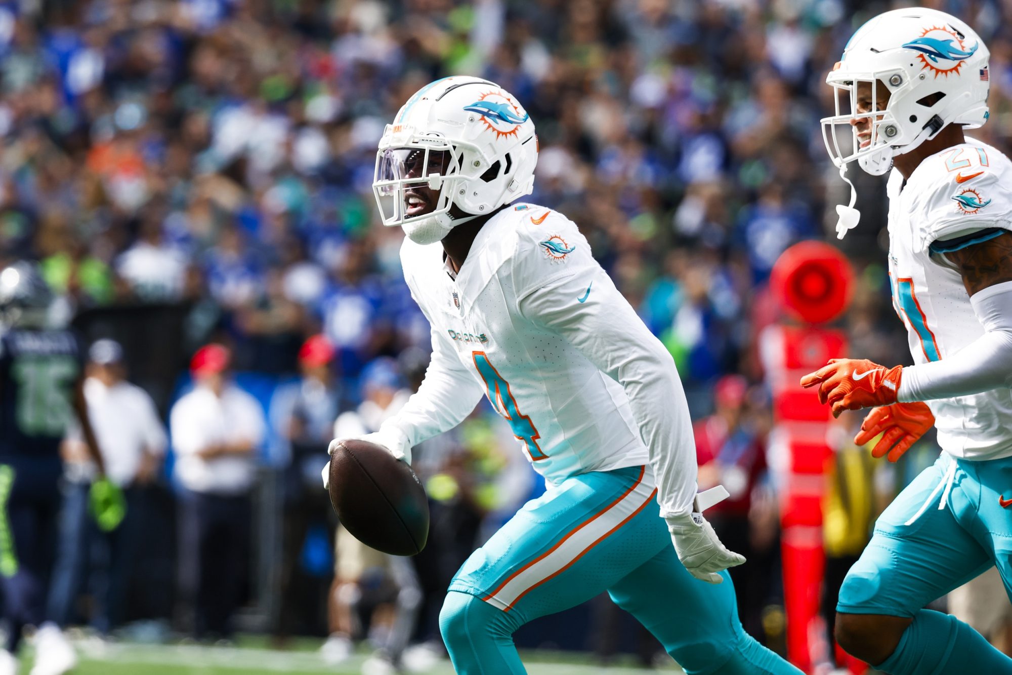 Sep 22, 2024; Seattle, Washington, USA; Miami Dolphins cornerback Kader Kohou (4) celebrates following an interception against the Seattle Seahawks during the first quarter at Lumen Field.