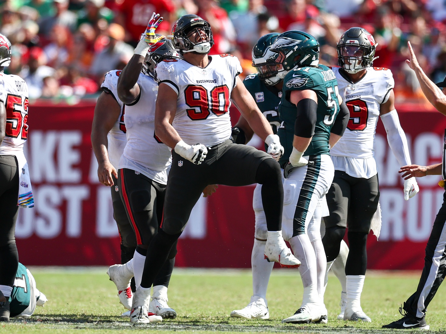 Sep 29, 2024; Tampa, Florida, USA; Tampa Bay Buccaneers defensive end Logan Hall (90) reacts after a sack against the Philadelphia Eagles in the fourth quarter at Raymond James Stadium.