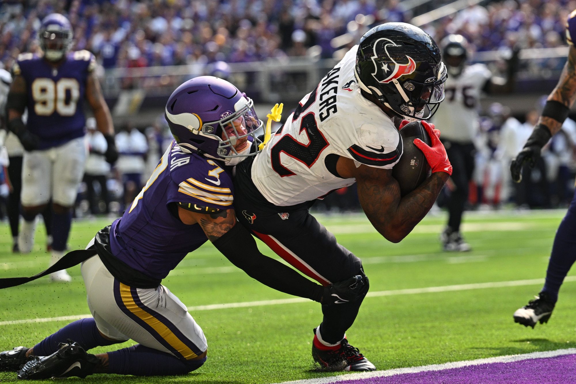 Sep 22, 2024; Minneapolis, Minnesota, USA; Houston Texans running back Cam Akers (22) runs for a touchdown as Minnesota Vikings cornerback Byron Murphy Jr. (7) attempts to make the tackle during the third quarter at U.S. Bank Stadium.