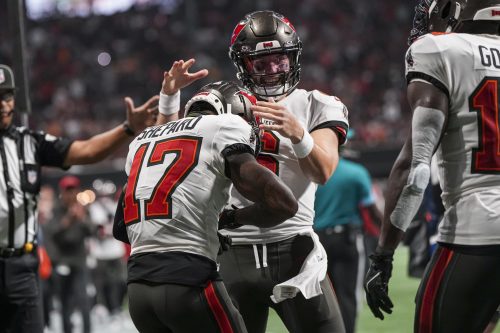 Oct 3, 2024; Atlanta, Georgia, USA; Tampa Bay Buccaneers wide receiver Sterling Shepard (17) reacts with quarterback Baker Mayfield (6) after catching a touchdown against the Atlanta Falcons during the first half at Mercedes-Benz Stadium.