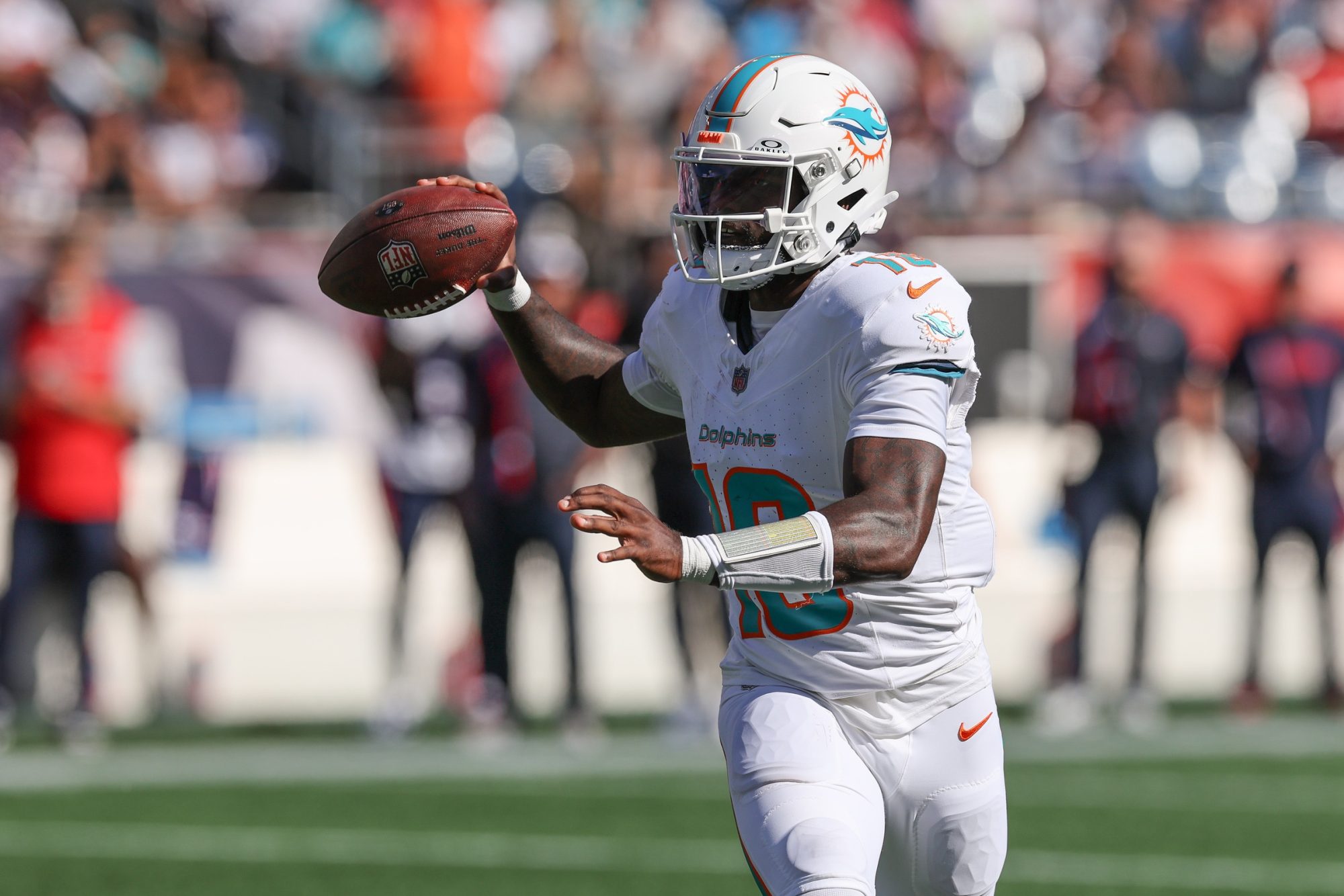 Oct 6, 2024; Foxborough, Massachusetts, USA; Miami Dolphins quarterback Tyler Huntley (18) throws the ball during the first half against the New England Patriots at Gillette Stadium.