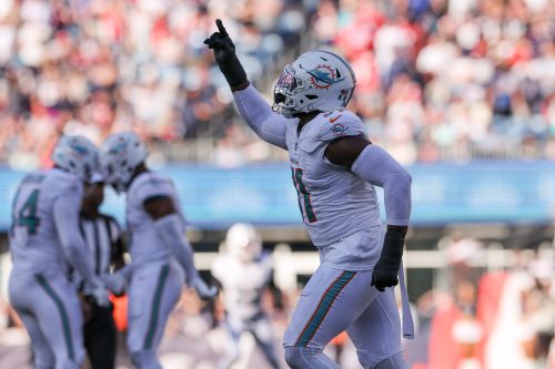 Oct 6, 2024; Foxborough, Massachusetts, USA; Miami Dolphins linebacker Emmanuel Ogbah (91) celebrates during the second half against the New England Patriots at Gillette Stadium.