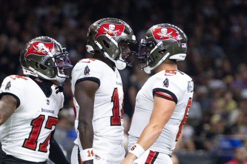 Oct 13, 2024; New Orleans, Louisiana, USA; Tampa Bay Buccaneers wide receiver Chris Godwin (14) and quarterback Baker Mayfield (6) celebrate a touchdown against the New Orleans Saints during he first half at Caesars Superdome.