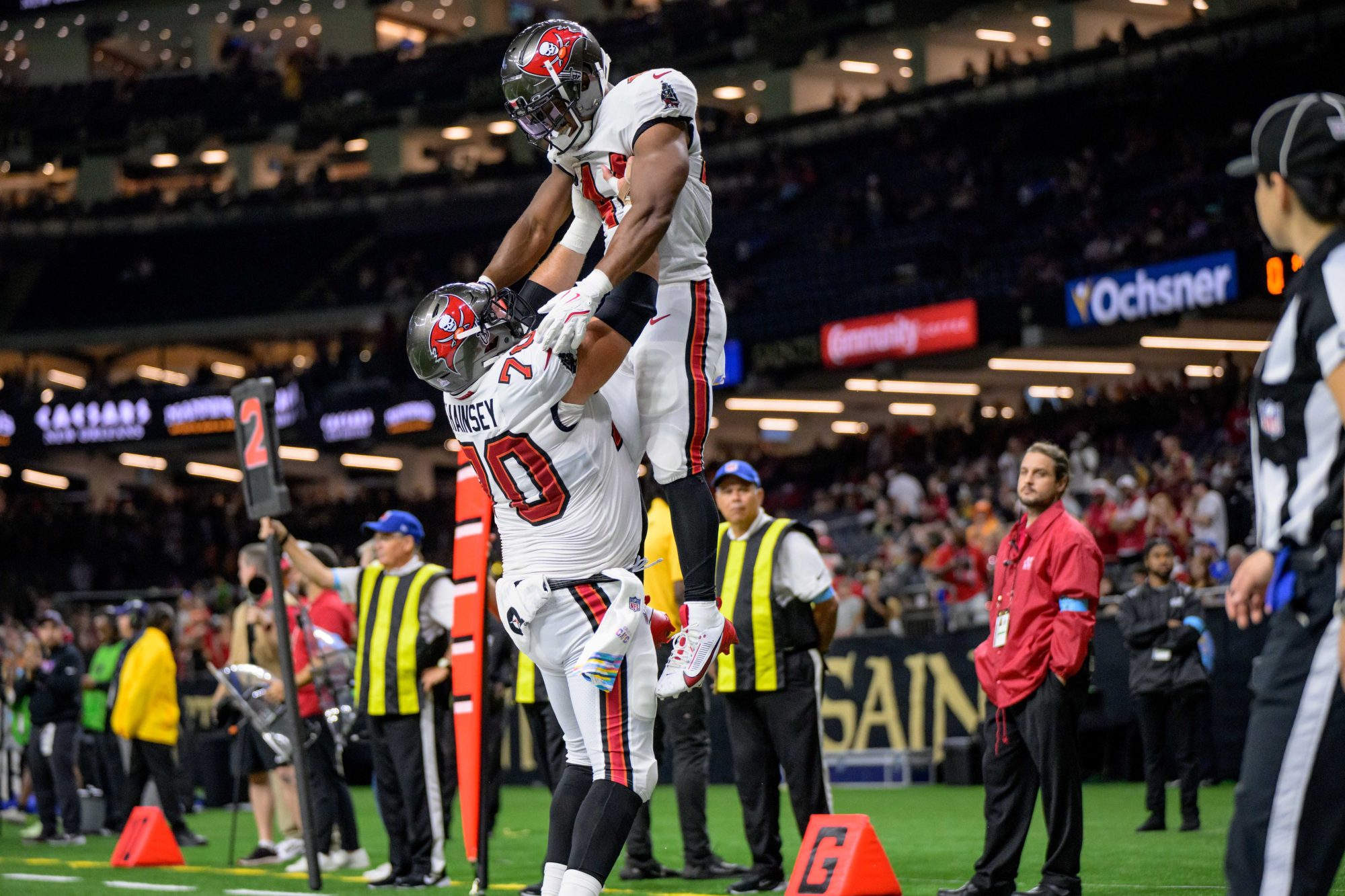 Oct 13, 2024; New Orleans, Louisiana, USA; Tampa Bay Buccaneers running back Sean Tucker (44) celebrates a touchdown with Tampa Bay Buccaneers center Robert Hainsey (70) during the fourth quarter against the New Orleans Saints at Caesars Superdome.