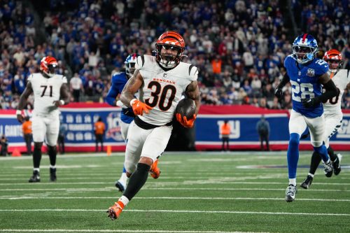 Bengals Chase Brown (30) dodges the Giants defense and takes the ball down the field to score a touchdown during their game against the Giants at MetLife Stadium on Sunday October 13, 2024. Bengals won the game with a final score of 17-7.