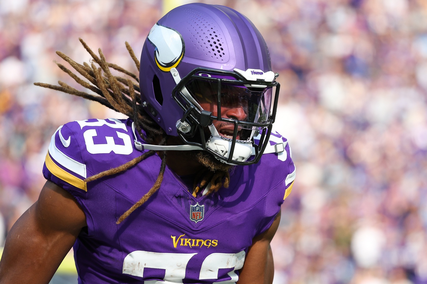 Oct 20, 2024; Minneapolis, Minnesota, USA; Minnesota Vikings running back Aaron Jones (33) celebrates his touchdown against the Detroit Lions during the first quarter at U.S. Bank Stadium.