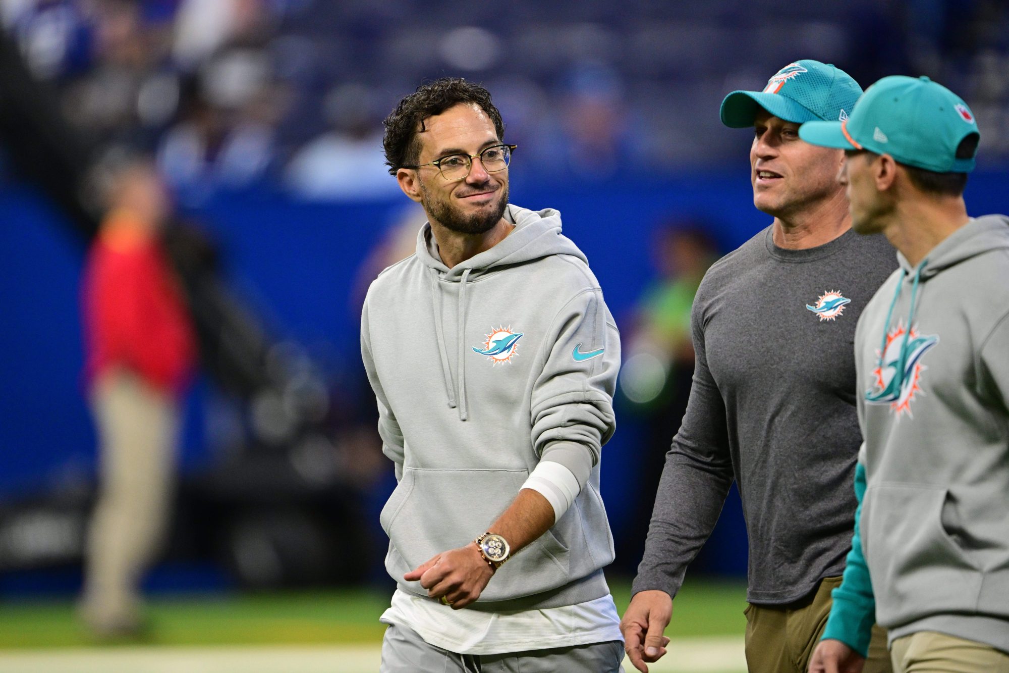 Oct 20, 2024; Indianapolis, Indiana, USA; Indianapolis Colts Miami Dolphins Head Coach Mike McDaniel talk with coaching staff while entering the field before the game against the Indianapolis Colts at Lucas Oil Stadium.