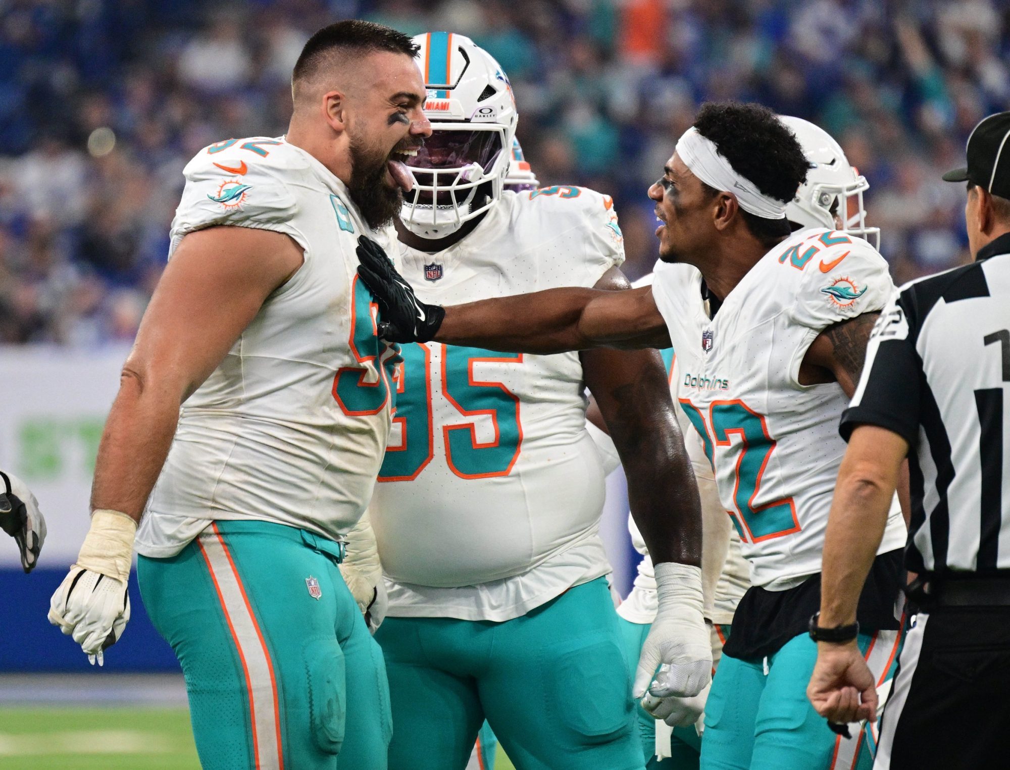 Oct 20, 2024; Indianapolis, Indiana, USA; Miami Dolphins defensive tackle Zach Sieler (92) celebrates a fumble recovery with safety Elijah Campbell (22) during the first quarter against the Indianapolis Colts at Lucas Oil Stadium.