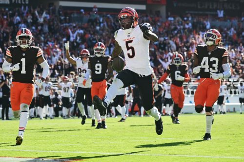 Oct 20, 2024; Cleveland, Ohio, USA; Cincinnati Bengals wide receiver Tee Higgins (5) scores a touchdown during the second half against the Cleveland Browns at Huntington Bank Field.