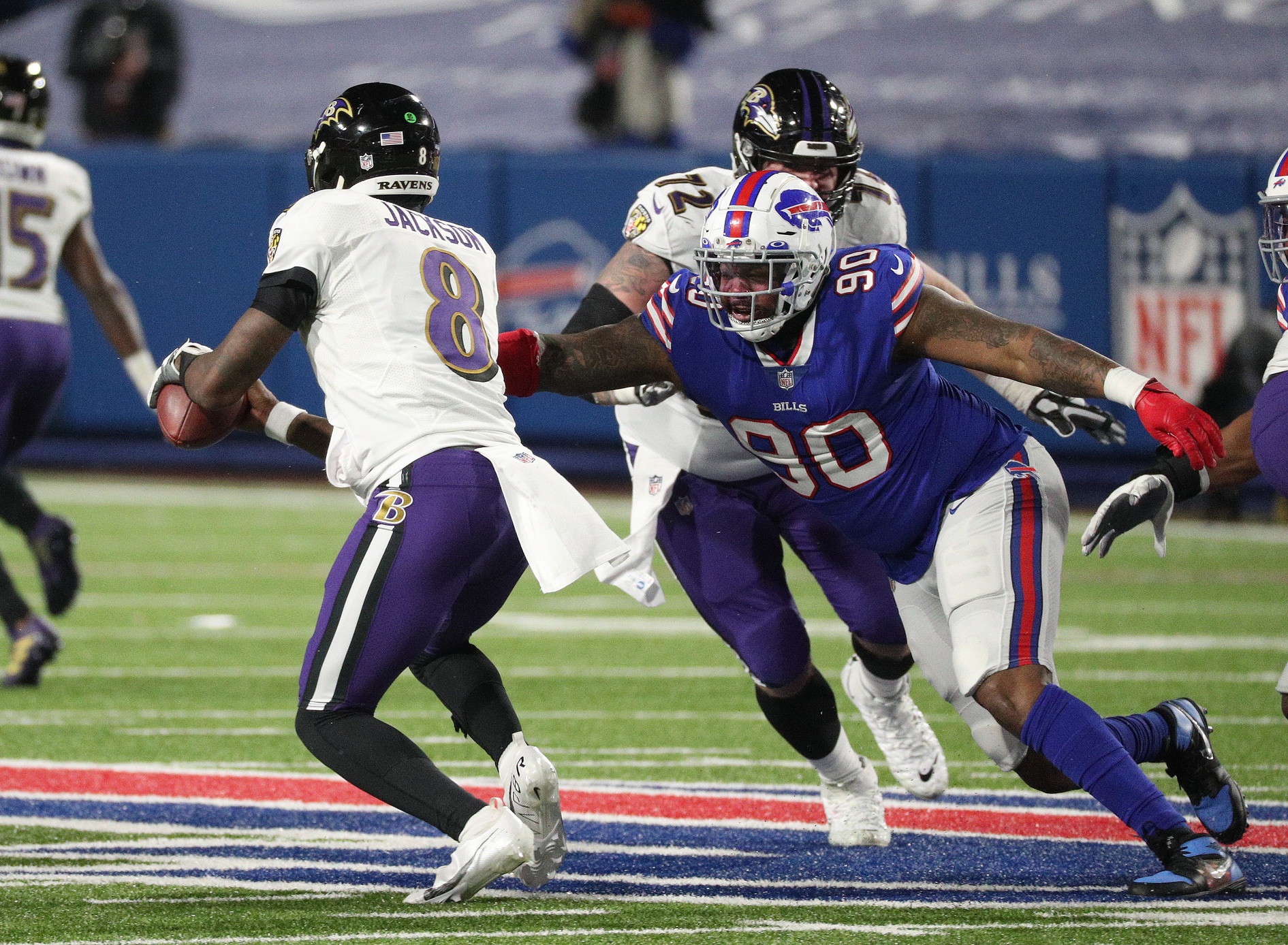 Bills Quinton Jefferson pressures Ravens quarterback Lamar Jackson.