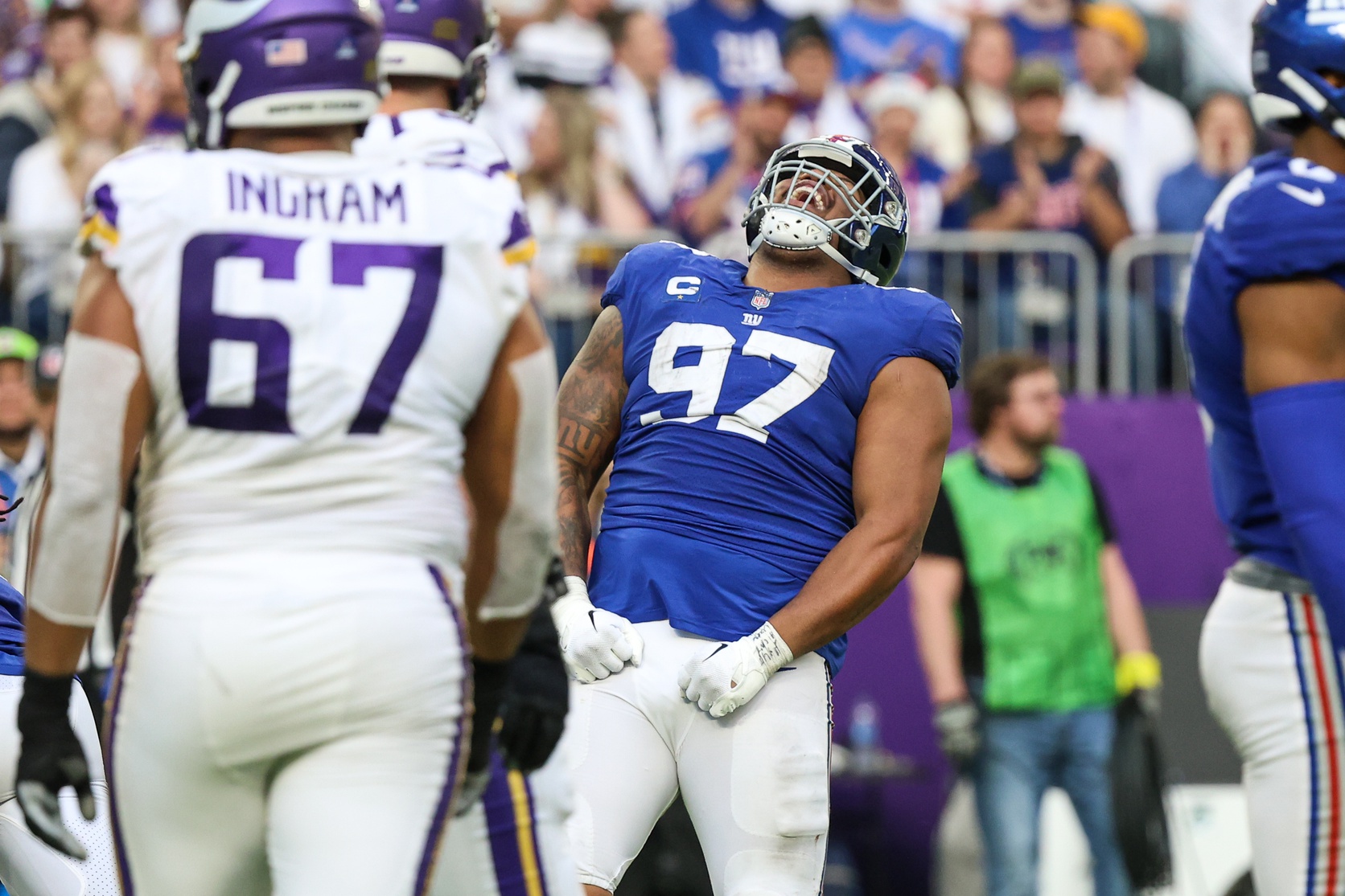 Dec 24, 2022; Minneapolis, Minnesota, USA; New York Giants defensive tackle Dexter Lawrence (97) celebrates a tackle against the Minnesota Vikings during the fourth quarter at U.S. Bank Stadium.