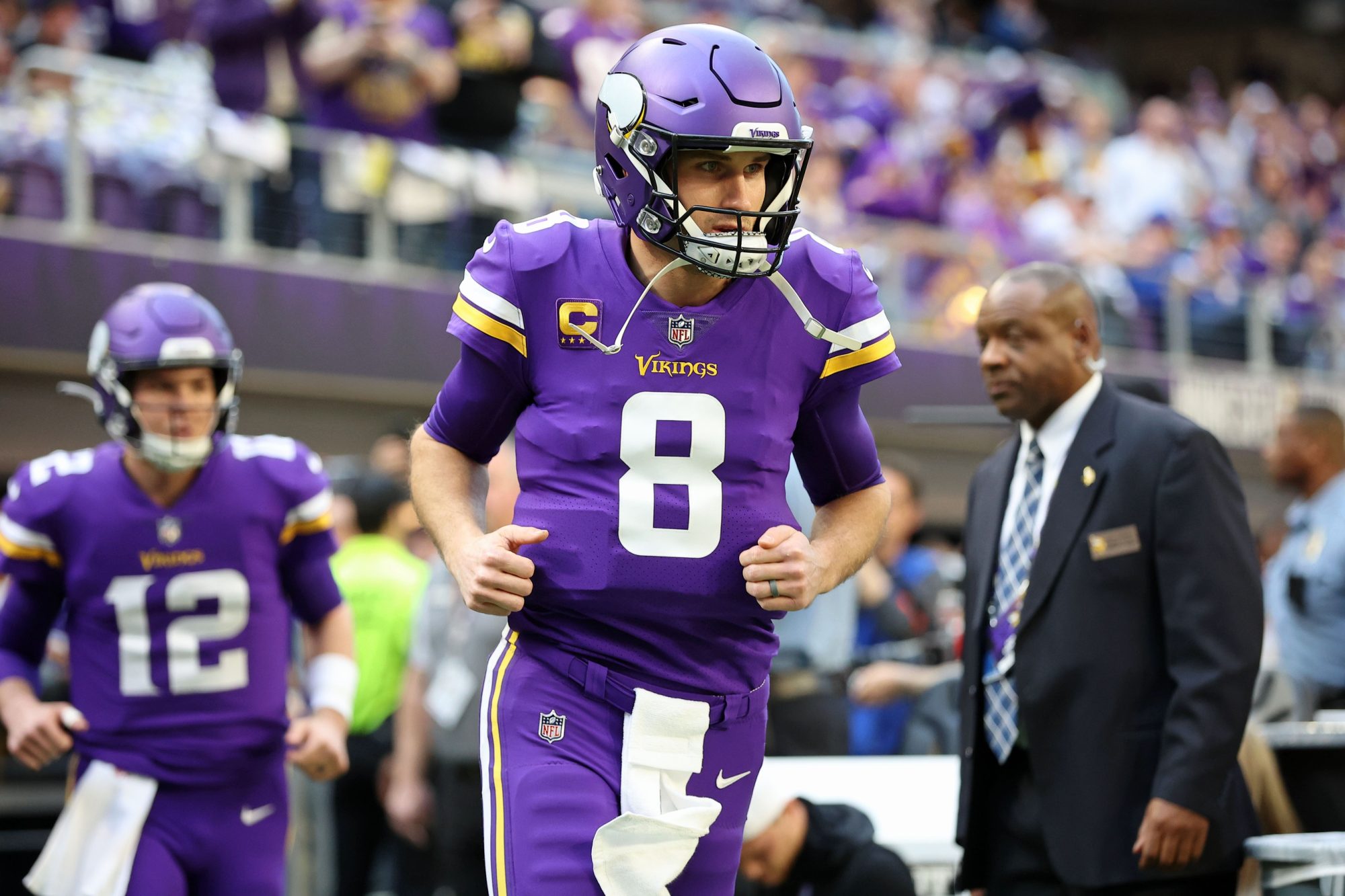 Jan 15, 2023; Minneapolis, Minnesota, USA; Minnesota Vikings quarterback Kirk Cousins (8) runs onto the field before a wild card game against the New York Giants at U.S. Bank Stadium.