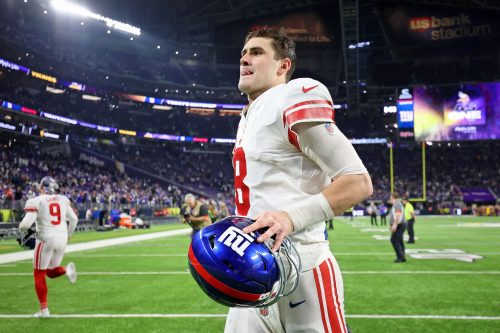 Jan 15, 2023; Minneapolis, Minnesota, USA; New York Giants quarterback Daniel Jones (8) runs off the field after winning a wild card game against the Minnesota Vikings at U.S. Bank Stadium.