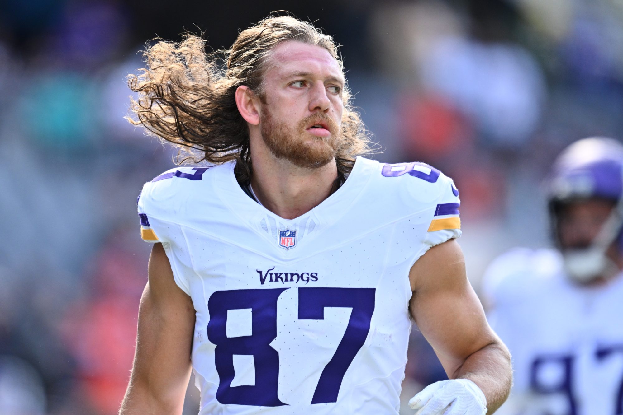 Oct 15, 2023; Chicago, Illinois, USA; Minnesota Vikings tight end T.J. Hockenson (87) runs off the field after pregame warmups before a game against the Chicago Bears at Soldier Field.