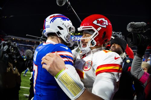 Jan 21, 2024; Orchard Park, New York, USA; Kansas City Chiefs quarterback Patrick Mahomes (15) greets Buffalo Bills quarterback Josh Allen (17) following the 2024 AFC divisional round game at Highmark Stadium.