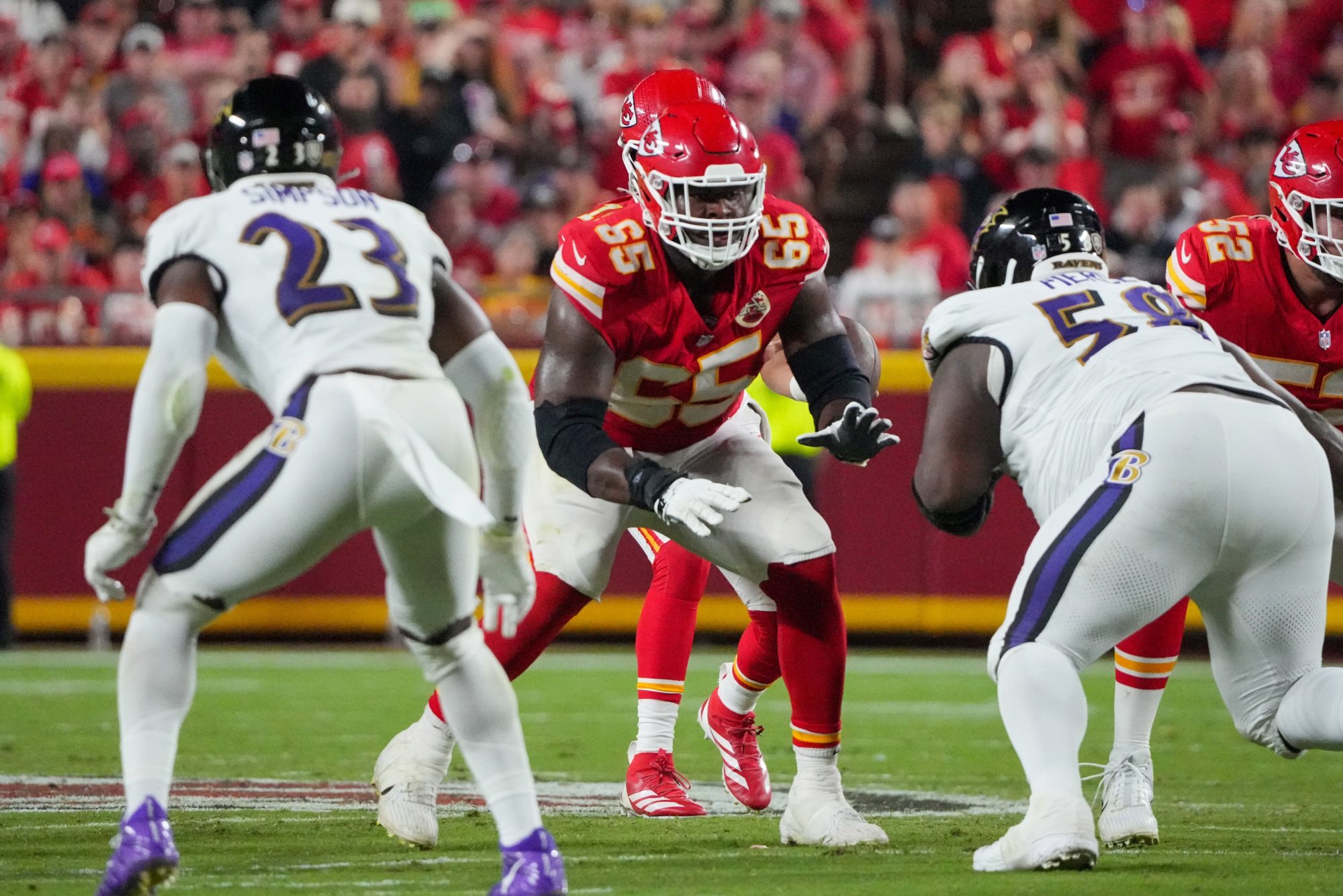 Sep 5, 2024; Kansas City, Missouri, USA; Kansas City Chiefs guard Trey Smith (65) at the line of scrimmage against the Baltimore Ravens during the game at GEHA Field at Arrowhead Stadium.