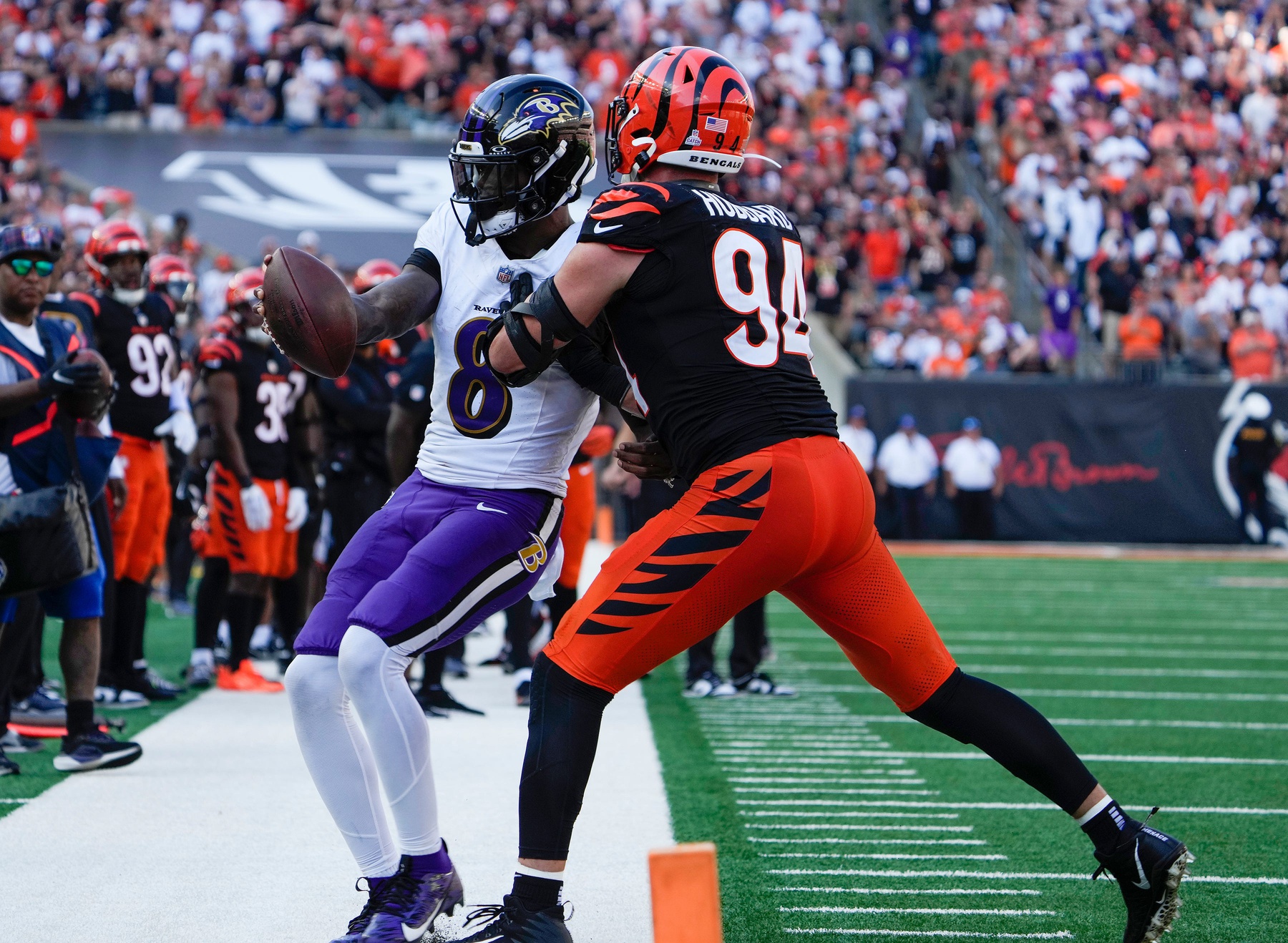 Cincinnati Bengals defensive end Sam Hubbard (94) pushes Baltimore Ravens quarterback Lamar Jackson (8) out of bounds during the 4th quarter Sunday October 6, 2024 at Payor Stadium.