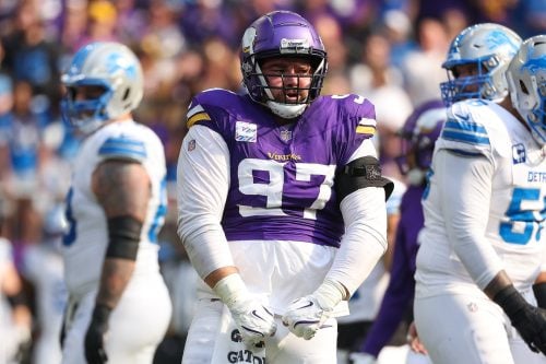 Oct 20, 2024; Minneapolis, Minnesota, USA; Minnesota Vikings defensive tackle Harrison Phillips (97) celebrates a tackle against the Detroit Lions during the first quarter at U.S. Bank Stadium.