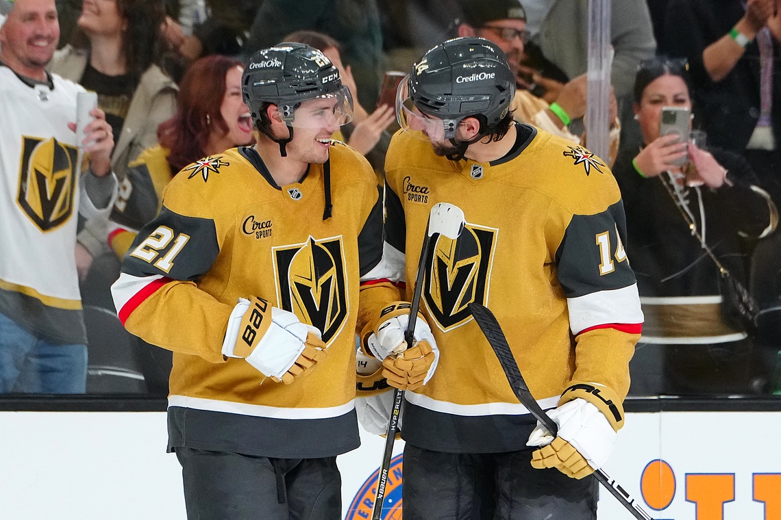 Nov 2, 2024; Las Vegas, Nevada, USA; Vegas Golden Knights center Brett Howden (21) celebrates with defenseman Nicolas Hague (14) after scoring a goal against the Utah Hockey Club in overtime to give the Golden Knights a 4-3 win at T-Mobile Arena.