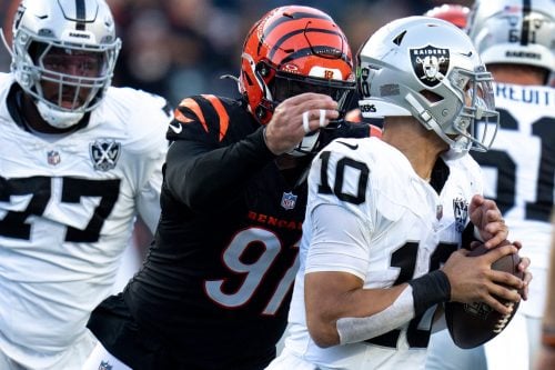 Cincinnati Bengals defensive end Trey Hendrickson (91) strips Las Vegas Raiders quarterback Desmond Ridder (10) of the ball in the fourth quarter of the NFL game at Paycor Stadium in Cincinnati on Sunday, Nov. 3, 2024.