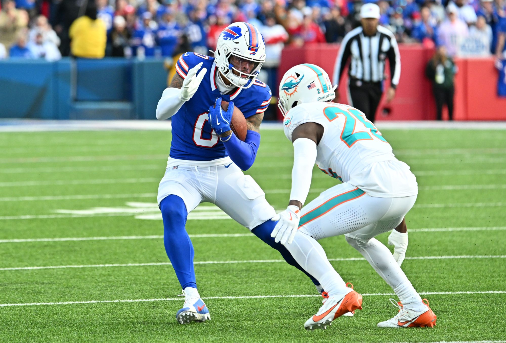 Nov 3, 2024; Orchard Park, New York, USA; Buffalo Bills wide receiver Keon Coleman (0) tries to avoid a tackle by Miami Dolphins safety Marcus Maye (26) in the fourth quarter at Highmark Stadium.